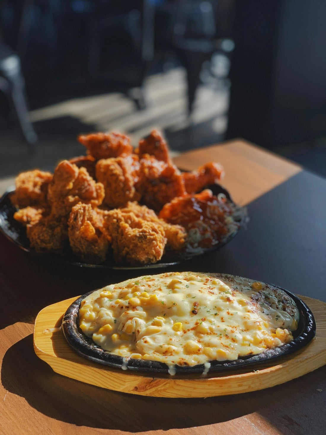Fried chicken and cheesy corn at a Black-owned soul food restaurant in Houston