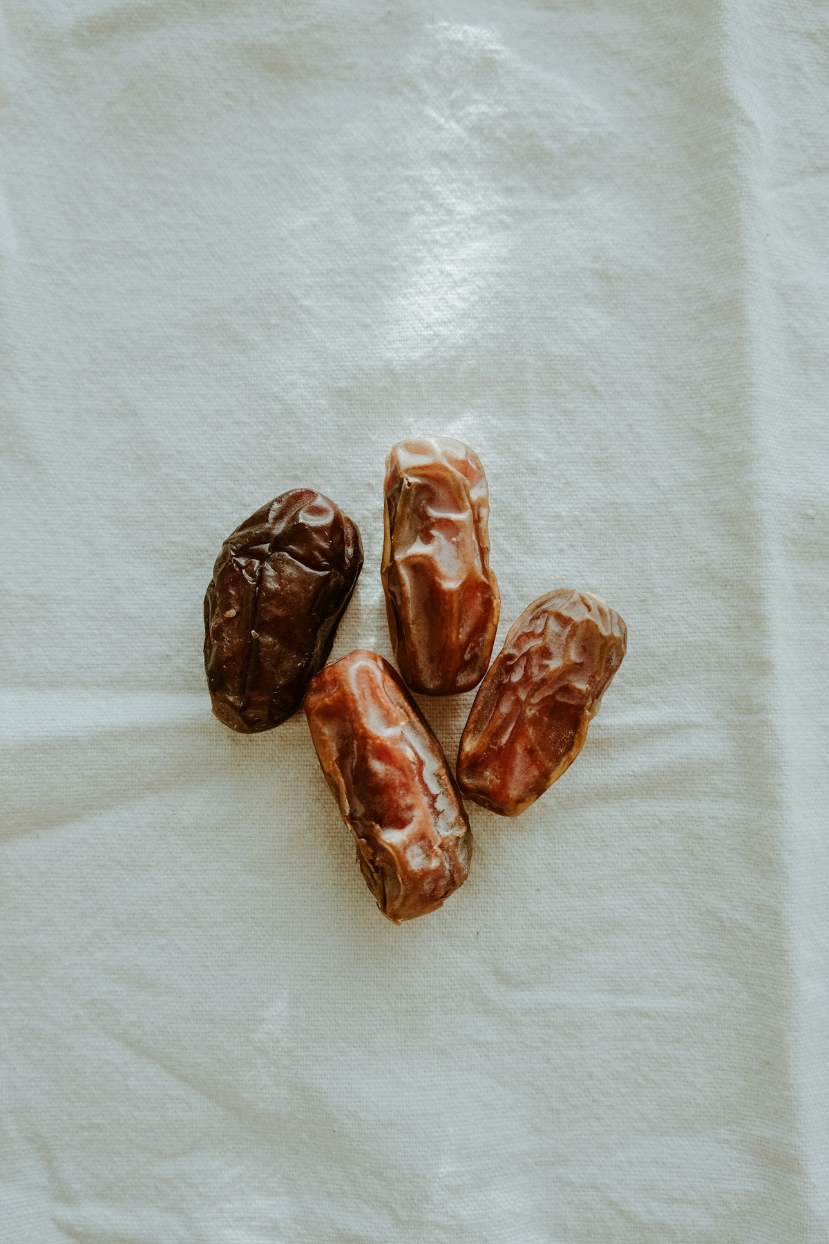 Medjool dates on a white towel